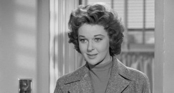 Movie still from “I'll Cry Tomorrow” (1955), directed by Daniel Mann – An old photo of a woman in a coat; Close Up shot, Over the shoulder angle