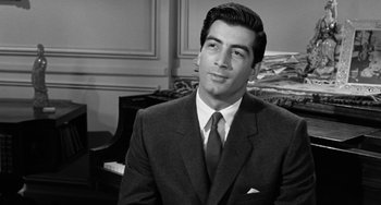 Movie still from “I'll Cry Tomorrow” (1955), directed by Daniel Mann – Black and white photograph of a man wearing a suit and tie; Close Up shot, Over the shoulder angle