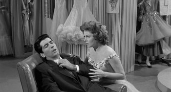 Movie still from “I'll Cry Tomorrow” (1955), directed by Daniel Mann – A man and a woman sitting next to each other in a room; Medium shot, High angle