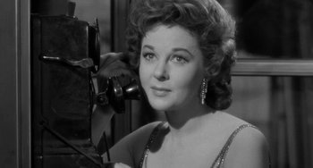 Movie still from “I'll Cry Tomorrow” (1955), directed by Daniel Mann – An old photo of an older woman with a camera; Close Up shot, Low angle