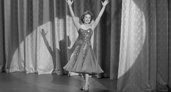 Movie still from “I'll Cry Tomorrow” (1955), directed by Daniel Mann – An old photo of a woman dancing on stage; Medium shot, Low angle