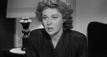 Movie still from “I'll Cry Tomorrow” (1955), directed by Daniel Mann – An old photo of an older woman in a black dress; Close Up shot, Over the shoulder angle