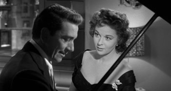 Movie still from “I'll Cry Tomorrow” (1955), directed by Daniel Mann – A man and a woman are looking at each other; Close Up shot, Over the shoulder angle