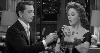 Movie still from “I'll Cry Tomorrow” (1955), directed by Daniel Mann – A man and a woman in a black and white photo; Medium shot, High angle