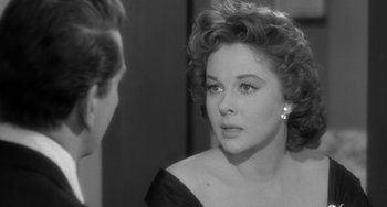 Movie still from “I'll Cry Tomorrow” (1955), directed by Daniel Mann – An old photo of a woman looking at a man; Close Up shot, Over the shoulder angle