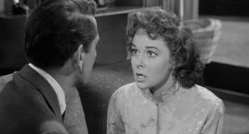 Movie still from “I'll Cry Tomorrow” (1955), directed by Daniel Mann – An old black and white photo of a woman and a young man; Close Up shot, Over the shoulder angle