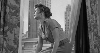 Movie still from “I'll Cry Tomorrow” (1955), directed by Daniel Mann – An old photo of a woman looking up at the sky; Medium shot, Low angle
