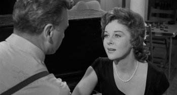 Movie still from “I'll Cry Tomorrow” (1955), directed by Daniel Mann – An older man and a young woman sitting next to each other; Close Up shot, Over the shoulder angle