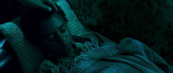 Movie still from “I'm Not There” (2007), directed by Todd Haynes – A person laying in bed under a blanket at night; Close Up shot, Overhead angle
