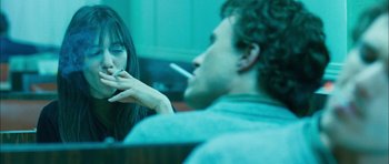 Movie still from “I'm Not There” (2007), directed by Todd Haynes – A man and a woman are smoking a cigarette together; Close Up shot, Over the shoulder angle