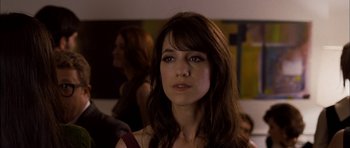 Movie still from “I'm Not There” (2007), directed by Todd Haynes – A person with long brown hair; Close Up shot, Over the shoulder angle