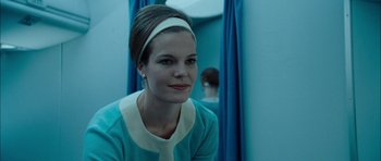 Movie still from “I'm Not There” (2007), directed by Todd Haynes – A woman in a blue dress and a white headband; Close Up shot, Over the shoulder angle