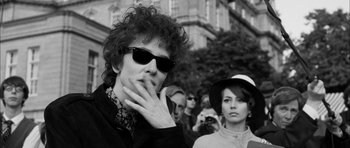 Movie still from “I'm Not There” (2007), directed by Todd Haynes – A black and white photo of a man and a woman; Medium shot, Over the shoulder angle