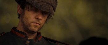 Movie still from “I'm Not There” (2007), directed by Todd Haynes – A person wearing a hat; Close Up shot, Low angle