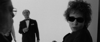 Movie still from “I'm Not There” (2007), directed by Todd Haynes – A man and a woman standing next to each other; Close Up shot, Low angle