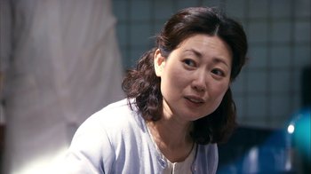 Movie still from “I'm a Cyborg, But That's OK” (2006), directed by Park Chan-wook – A person sitting in front of a window; Close Up shot, Over the shoulder angle