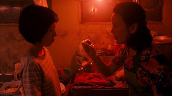 Movie still from “I'm a Cyborg, But That's OK” (2006), directed by Park Chan-wook – A woman putting makeup on another woman's face; Close Up shot, High angle