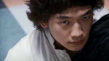 Movie still from “I'm a Cyborg, But That's OK” (2006), directed by Park Chan-wook – A person wearing a white shirt; Close Up shot, Over the shoulder angle