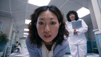 Movie still from “I'm a Cyborg, But That's OK” (2006), directed by Park Chan-wook – Two women in a room with one of them looking at the camera; Close Up shot, Low angle
