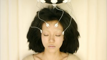 Movie still from “I'm a Cyborg, But That's OK” (2006), directed by Park Chan-wook – A woman with a bunch of wires on her head; Close Up shot, Overhead angle