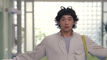 Movie still from “I'm a Cyborg, But That's OK” (2006), directed by Park Chan-wook – A young man with long black hair wearing a white shirt; Close Up shot, Over the shoulder angle