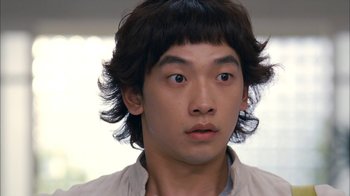 Movie still from “I'm a Cyborg, But That's OK” (2006), directed by Park Chan-wook – A young man with long black hair wearing a beige shirt; Close Up shot, High angle
