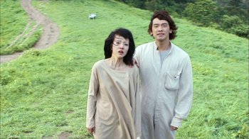 Movie still from “I'm a Cyborg, But That's OK” (2006), directed by Park Chan-wook – A man and a woman standing next to each other in a field; Medium shot, High angle