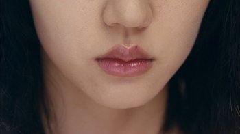 Movie still from “I'm a Cyborg, But That's OK” (2006), directed by Park Chan-wook – View of a young woman's lips; Extreme Close Up shot, Overhead angle