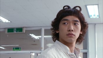 Movie still from “I'm a Cyborg, But That's OK” (2006), directed by Park Chan-wook – A young man with two buns on his head; Close Up shot, Low angle