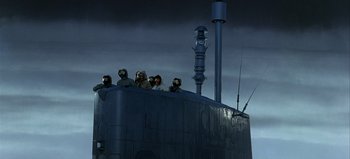 Movie still from “Ice Station Zebra” (1968), directed by John Sturges – A group of people sitting on top of a boat; Wide shot, Low angle