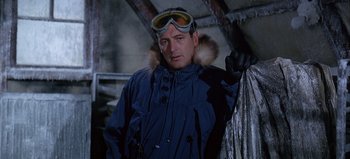 Movie still from “Ice Station Zebra” (1968), directed by John Sturges – A man wearing a blue jacket and goggles; Close Up shot, Low angle