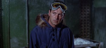 Movie still from “Ice Station Zebra” (1968), directed by John Sturges – A man in a blue jacket and goggles; Close Up shot, Low angle