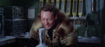 Movie still from “Ice Station Zebra” (1968), directed by John Sturges – A man wearing a fur coat and a fur jacket; Close Up shot, Low angle