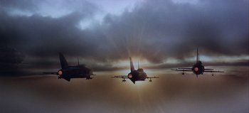 Movie still from “Ice Station Zebra” (1968), directed by John Sturges – A group of planes flying in the sky during a cloudy day; Extreme Wide shot, Low angle