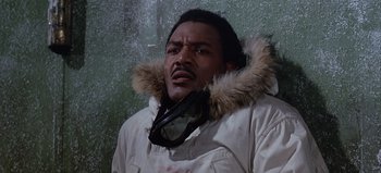 Movie still from “Ice Station Zebra” (1968), directed by John Sturges – A man in a parka with a fur trimmed hood; Close Up shot, Low angle