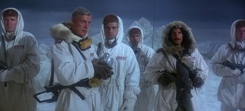 Movie still from “Ice Station Zebra” (1968), directed by John Sturges – A group of men standing next to each other; Medium shot, Low angle