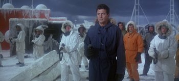 Movie still from “Ice Station Zebra” (1968), directed by John Sturges – A group of people in snow suits standing in a row; Medium shot, Low angle