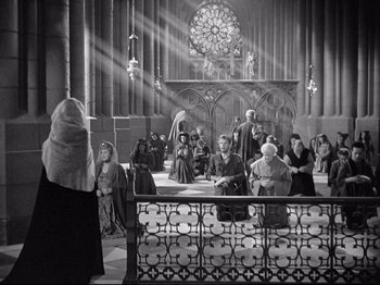 Movie still from “If I Were King” (1938), directed by Frank Lloyd – A group of people gathered in a large church; Extreme Wide shot, High angle