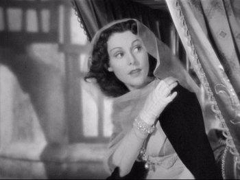 Movie still from “If I Were King” (1938), directed by Frank Lloyd – An old black and white photo of a woman wearing a veil; Close Up shot, Low angle