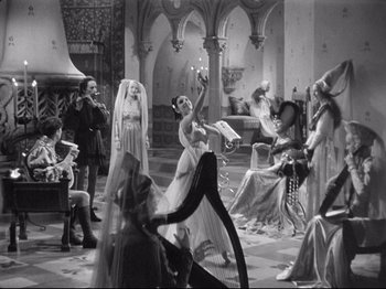 Movie still from “If I Were King” (1938), directed by Frank Lloyd – A black and white photo of a group of people; Wide shot, High angle