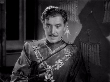 Movie still from “If I Were King” (1938), directed by Frank Lloyd – A black and white photo of a man with a mustache; Medium shot, High angle