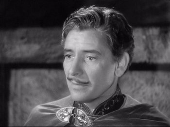 Movie still from “If I Were King” (1938), directed by Frank Lloyd – A black and white photo of a man with a mustache; Close Up shot, High angle