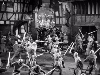 Movie still from “If I Were King” (1938), directed by Frank Lloyd – A black and white photo of a medieval battle scene; Extreme Wide shot, High angle