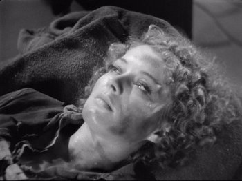 Movie still from “If I Were King” (1938), directed by Frank Lloyd – A black and white photo of a woman laying on a blanket; Close Up shot, High angle