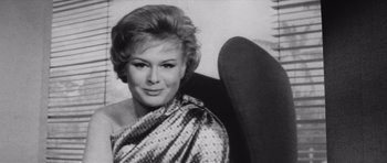 Movie still from “Voyage to the End of the Universe” (1963), directed by Jindrich Polák – An old black and white photo of a woman; Close Up shot, Low angle