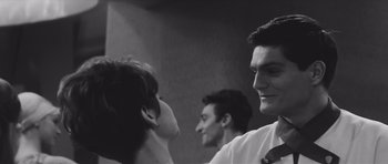 Movie still from “Voyage to the End of the Universe” (1963), directed by Jindrich Polák – Two men and a woman are talking to each other; Close Up shot, Over the shoulder angle
