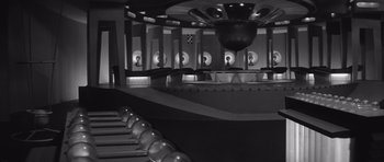 Movie still from “Voyage to the End of the Universe” (1963), directed by Jindrich Polák – A black - and - white photo of a bowling alley; Extreme Wide shot, High angle