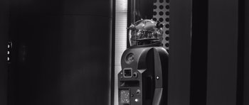 Movie still from “Voyage to the End of the Universe” (1963), directed by Jindrich Polák – A black and white photo of a parking meter; Medium shot, High angle