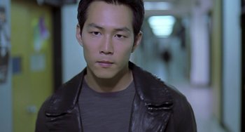 Movie still from “Il Mare” (2000), directed by Hyun-seung Lee – A person wearing a leather jacket; Close Up shot, High angle