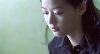 Movie still from “Il Mare” (2000), directed by Hyun-seung Lee – A person looking out of a window; Close Up shot, Low angle
